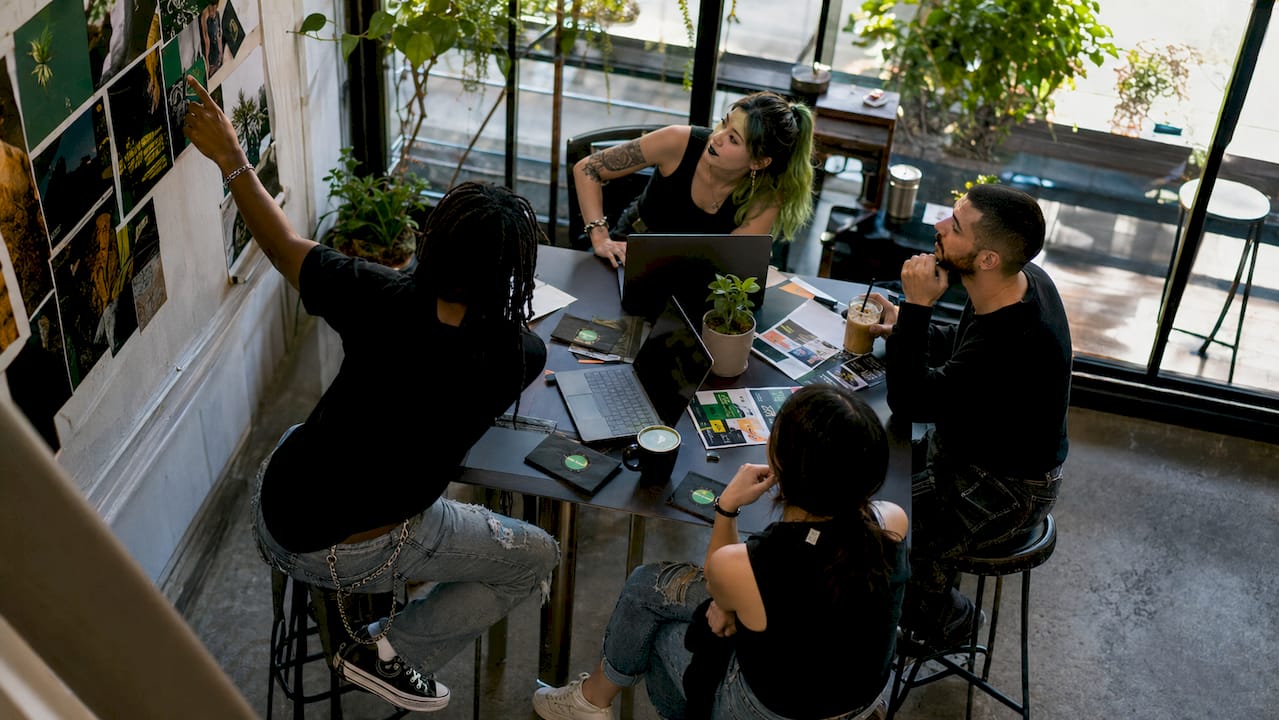 Team planning mental health fundraiser at nonprofit office