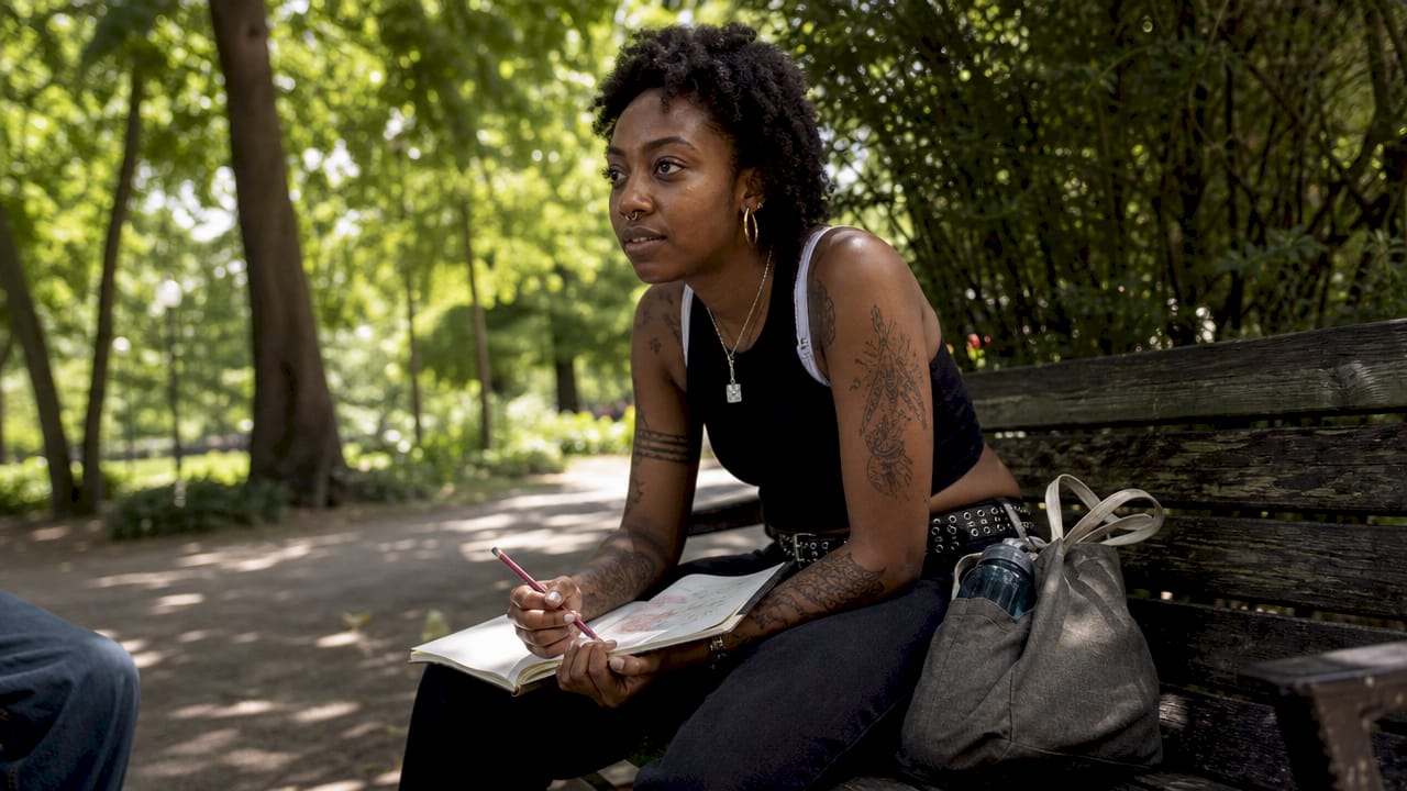Young woman listening attentively in mental health meeting