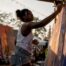 Artist painting anti-stigma mural in studio