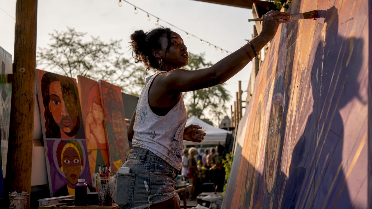 Artist painting anti-stigma mural in studio