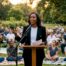 Woman speaking at community awareness event