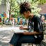 Young woman sketching creative advocacy artwork