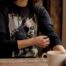 Close-up of person adjusting awareness t-shirt sleeve