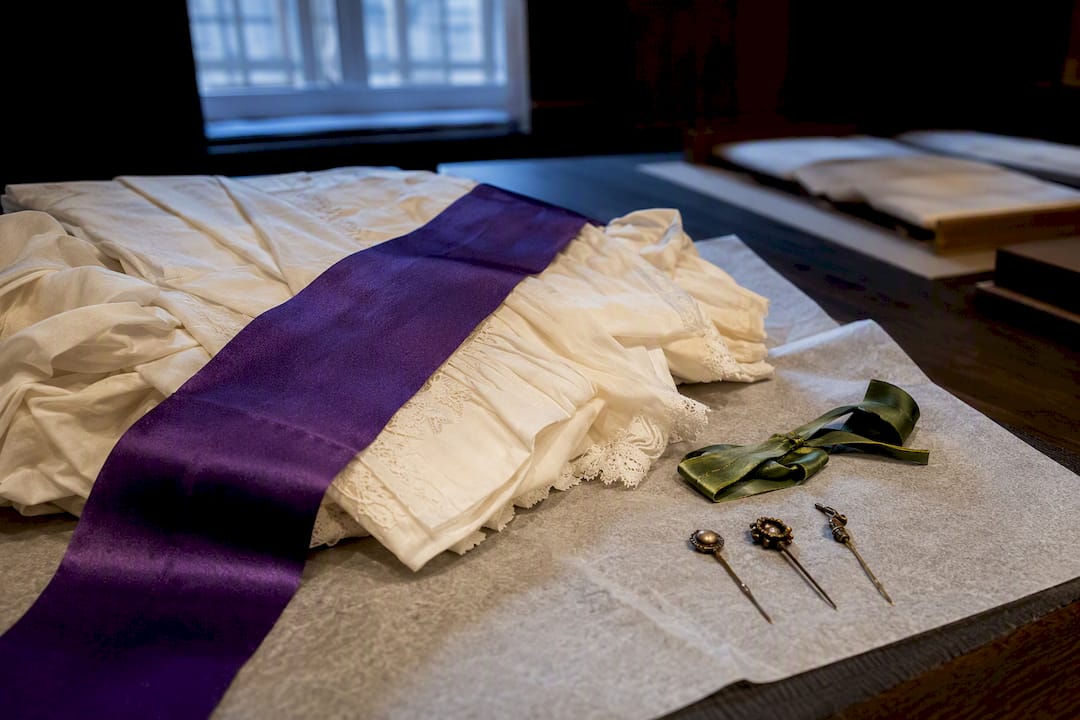 Suffrage colors arranged on archival textiles