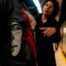 Commuters discussing partial graphic shirt