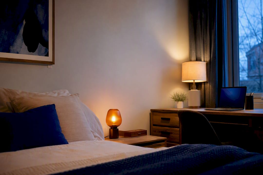 Calm dorm room with layered warm lighting