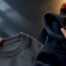 Hands comparing anonymous collar and hood details