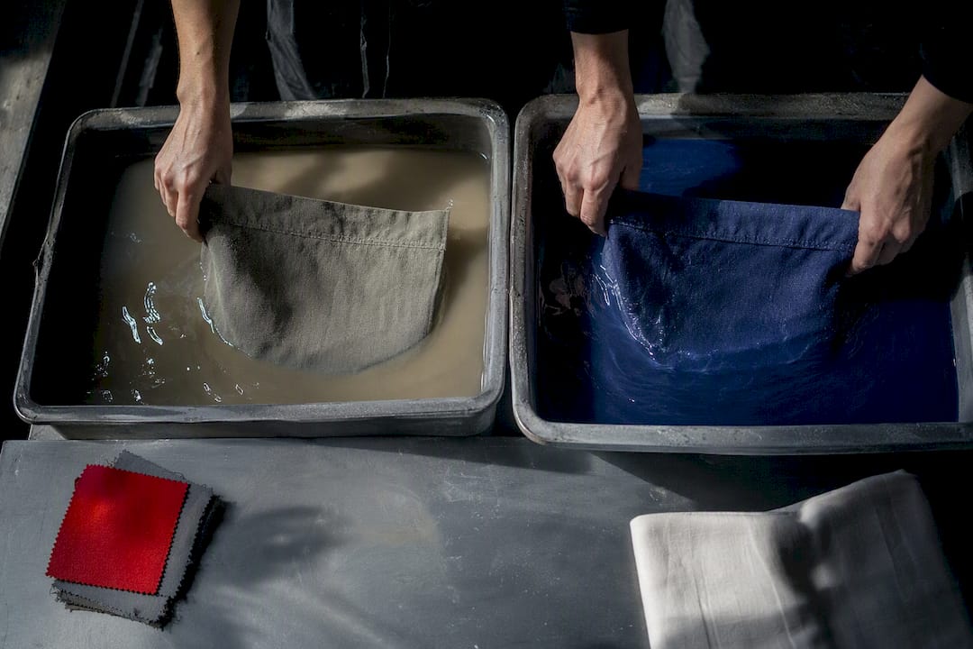 Fabric panels immersed in contrasting dye baths