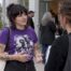 Attendees discussing an advocacy outfit at fundraiser