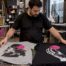 Printmaker compares graphics on heather and solid tees