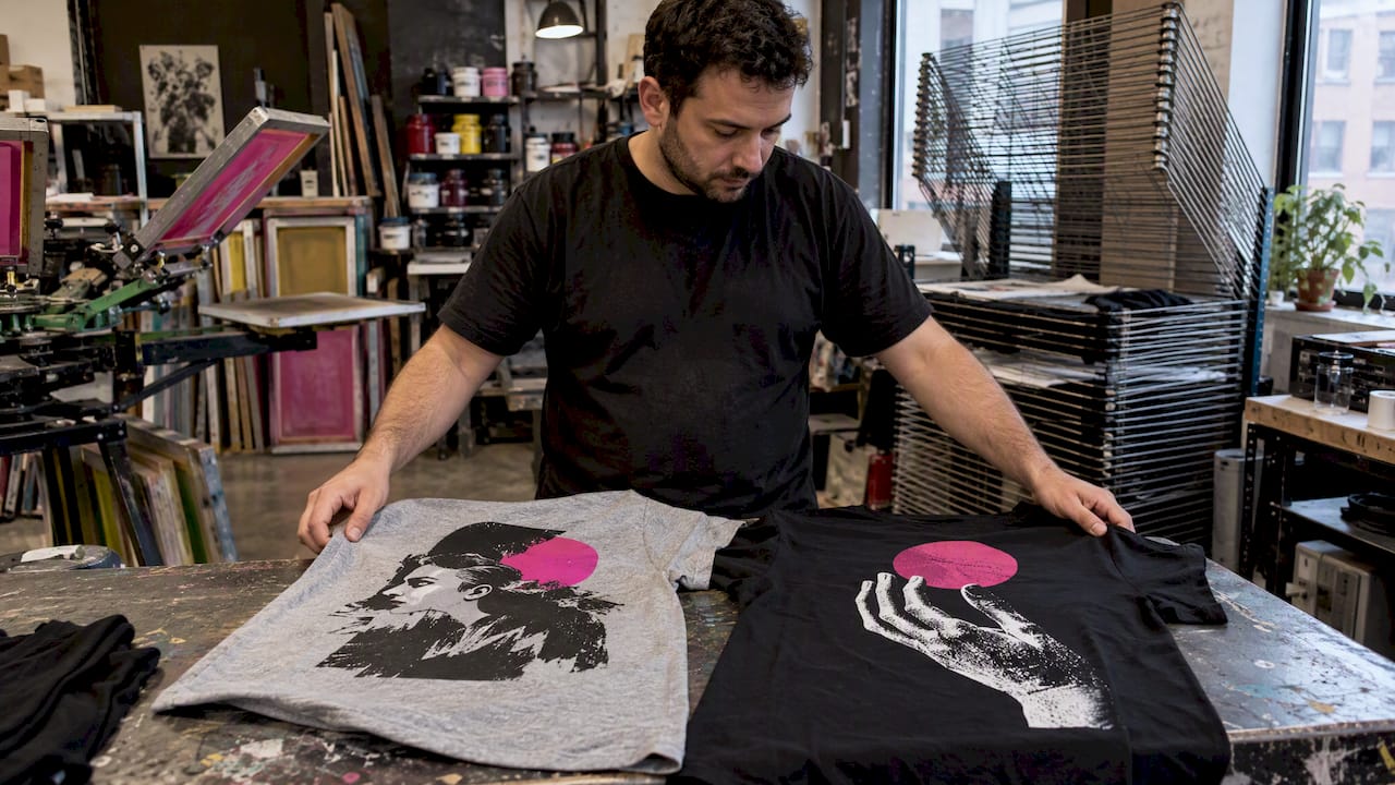 Printmaker compares graphics on heather and solid tees