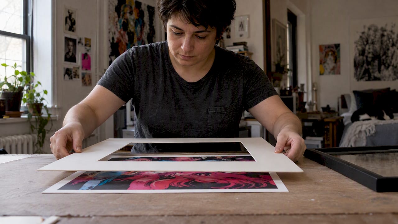 Art print tucked beneath a window mat