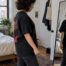 Person checking oversized tee fit